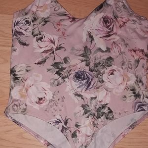 A floral bodysuit- runs slightly large.